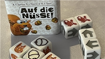 Würfelspiel „Auf die Nüsse"