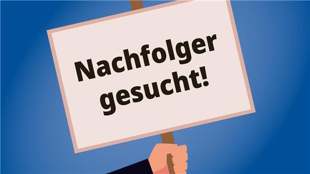 Wie Unternehmen einen passenden Nachfolger finden Eine Hand hält ein Schild, worauf steht, Nachfolger gesucht.