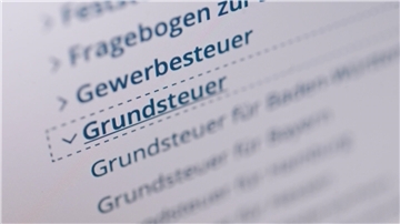 Desktop, auf dem Grundsteuer steht.