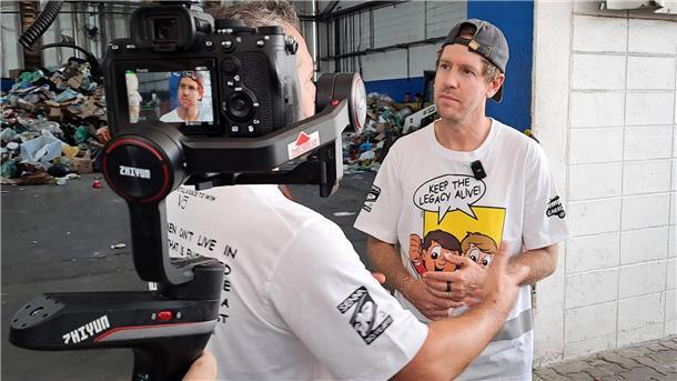 Vettel sammelt Müll in São Paulo: „Wir räumen auf“ Er erklärt einem TV-Team die Aktion.