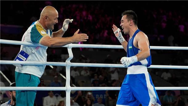 Britische Teammitarbeiter retten Coach bei Olympia das Leben Hasanboy Dusmatov (r) gewann in Paris Gold, sein Trainer Tulkin Kilichev kollabierte bei der anschließenden Feier.