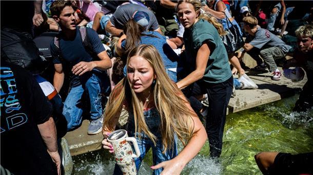 „Politisches Attentat“: Einflussreicher Trump-Anhänger tot Menschen rennen weg, nachdem Kirk angeschossen wurde.