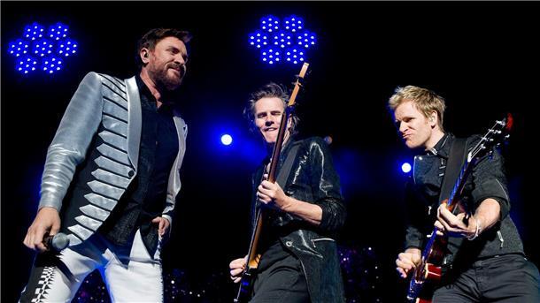 Sänger Simon Le Bon (l-r), Bassgitarrist John Taylor und Gitarrist Andy Taylor von Duran Duran 2012 in Budapest.