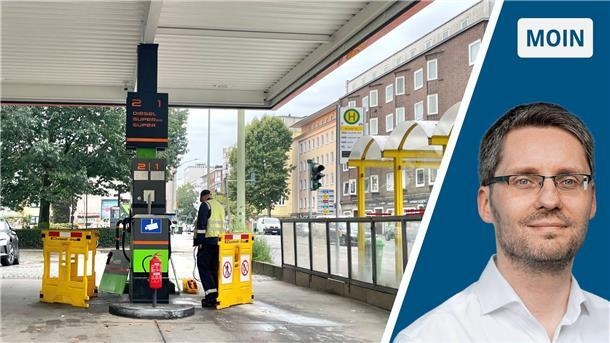Eine Zapfsäule an einer Tankstelle. Die Zapfsäule ist abgesperrt. Ein Mann und Absperrbaken stehen davor.