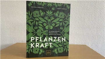 Ein Buchcover mit Pflanzen.